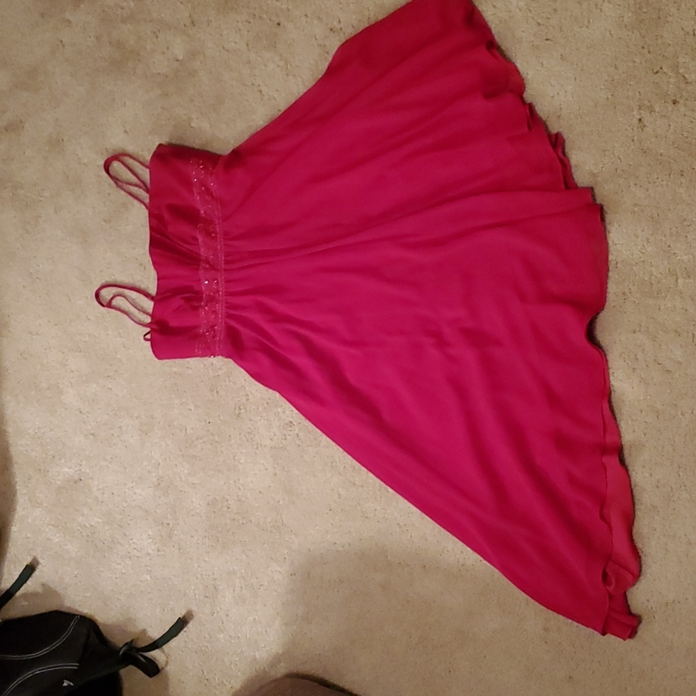 Red  Knee length asymmetrical hem dress.